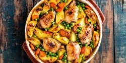 Chicken roasted on a bed of vegetables