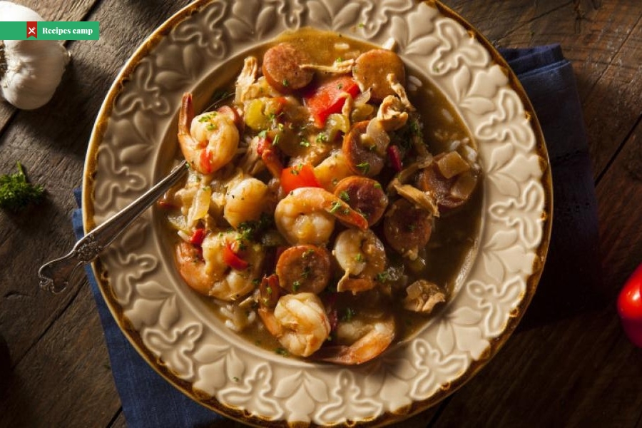 Sausage, Shrimp and Peppers over Cheesy Grits
