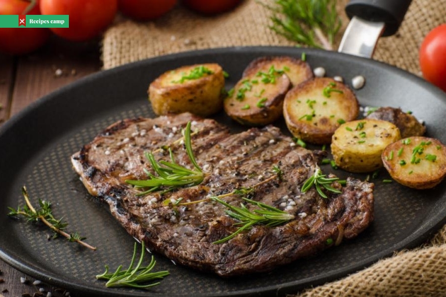 Steak and tomatoes with herb-roasted potatoes